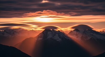 Naklejka premium Dramatic Sunset Over Mountain Peaks.