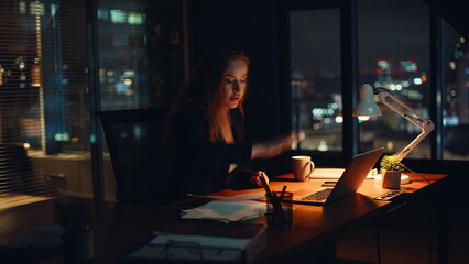 Stressed office worker arguing in virtual meeting during late hours closeup