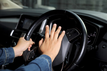The driver is honking the horn to prevent an accident