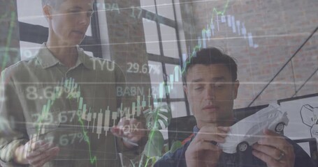 This video is about car designers discussing a model car at a desk in an office - Powered by Adobe