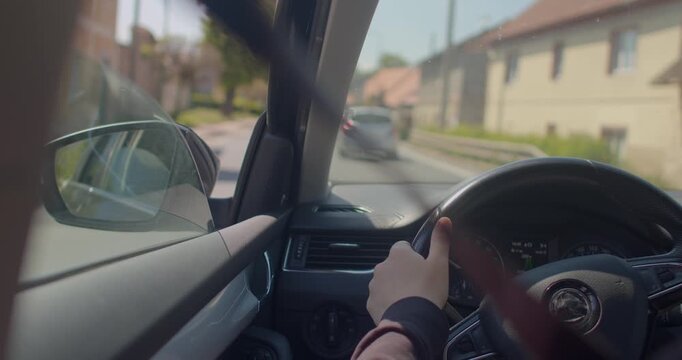 This captivating footage from a moving car offers a vivid glimpse into urban scenes, showcasing vibrant traffic lights and diverse driver actions during commutes through the bustling city