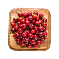 A vibrant collection of fresh red cherries artfully arranged on a wooden board