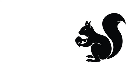 Black silhouette of a squirrel holding an acorn