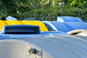 View of garbage bins. View of colorful trash dumpsters. Colorful trash containers. The concept of...