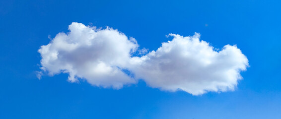 Cotton ball A lonely cloud moves freely across the blue sky. The gentle movement of an atmospheric...