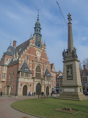 Two sights of the  Hoorn city - Westfries Museum and the Monument of Jan Pieterszoon Coen - on Rode Steen square, The Netherlands