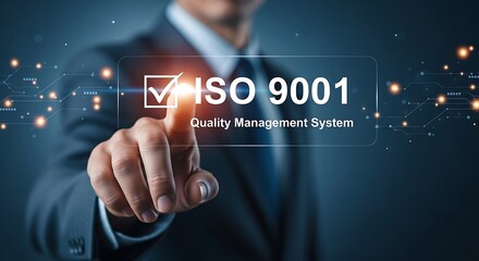 Fototapeta premium Businessman pointing to ISO 9001 Quality Management System certification on screen ISO 9001
