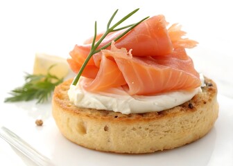 Toasted English muffin canapé with silky salmon and creamy cheese spread on pure white backdrop