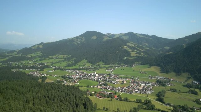Drone view of an idylic village in the Austrian Alps.