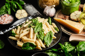 Delicious Penne Pasta with Pesto, Fresh Basil, and Parmesan Cheese