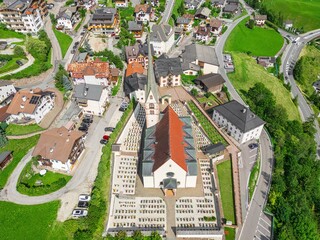 Aerial view of church and cemetery grounds in Santa Cristina Valgardena. South Tyrol, Italy