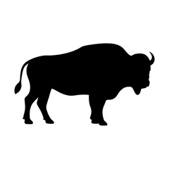 Silhouette of a majestic buffalo standing tall against a stark white backdrop