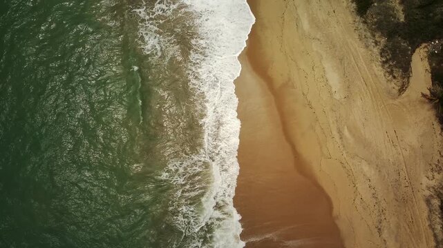 Aerial drone view of Coqueiros Beach with cliffs and ocean, Joao Pessoa, Para&iacute;ba, Brazil