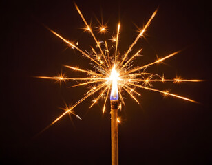 Single Glowing Sparkler Burning in Darkness