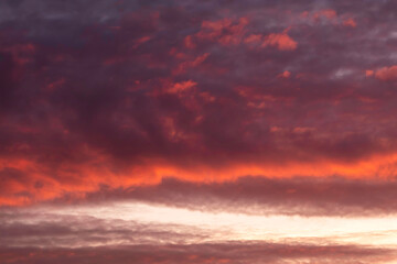 Colorful dramatic sunset sky with clouds.