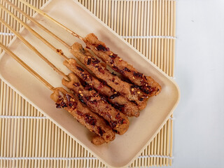 Sempol ayam, Indonesian street food made of chicken, spices, and eggs Served with chili oil.