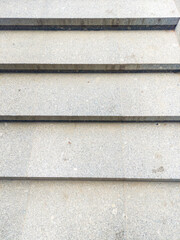 Modern granite stone staircase with smooth steps, simple geometry and neutral tones