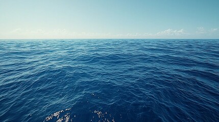 Fototapeta premium Tranquil Blue Ocean Waters Under a Pale Sky, Horizon Line and Gentle Ripples