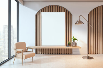 Fototapeta premium Modern empty living room with vertical blank canvas on wood panel wall, beige armchair and floor lamp, city view through large window. 3D Rendering