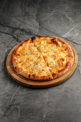Close-up of freshly baked cheese pizza with melted cheese and golden crust. Traditional Italian fast food concept, isolated top view.