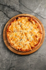 Close-up of freshly baked cheese pizza with melted cheese and golden crust. Traditional Italian fast food concept, isolated top view.