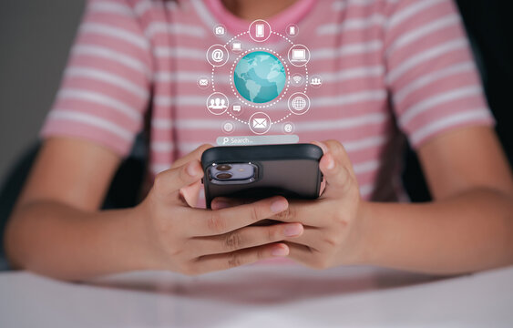 Woman using mobile smartphone with E-commerce technology icon on virtual global internet network, online retail shopping digital app.