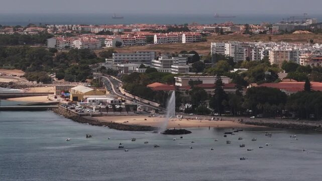 Aerial drone view of a geyser at Paco dos Arcos beach in Lisbon, Portugal at Praia Velha