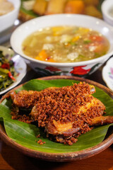 Crispy Fried Kampung Chicken (Free-Range), captured on September 1, 2025. Golden brown Indonesian dish on rustic plate, authentic homemade flavor, traditional culinary heritage