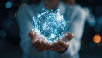 Fototapeta premium A woman's hands hold a glowing, digital representation of the Earth, overlaid with a network of light connections