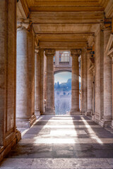 Sunlight between the Museum columns on Capitoline Hill in Rome, Italy