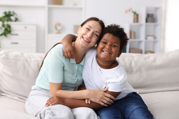 Adoption. Mother and her son at home