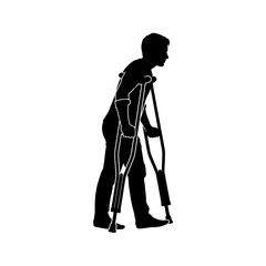 Determined man with crutches moves forward, showing resilience and recovery in his journey of healing and rehabilitation.