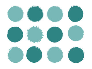Variety of teal blue circle paint splatter shapes on a white canvas gives artistic flair