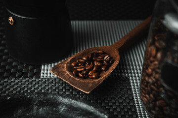 Photo of coffee beans with an Italian coffee maker.