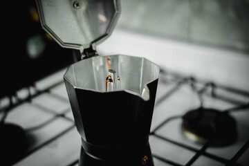 Photo of coffee beans with an Italian coffee maker.