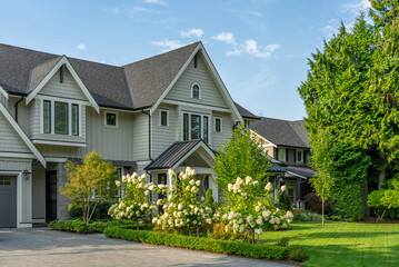 Two story luxury house with beautiful summer  landscape in Vancouver, Canada, North America. Day time on August 2025.