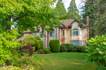 Two story luxury house with beautiful summer  landscape in Vancouver, Canada, North America. Day time on August 2025.