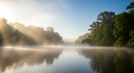 Fototapeta premium Misty Morning Sunrise Over a Calm River.