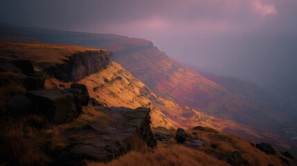A dramatic mountain vista bathed in the warm hues of a late afternoon light, showcasing a steep cliff face and the surrounding landscape.