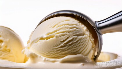 a close up of vanilla ice cream being scooped with a metal ice cream scooper