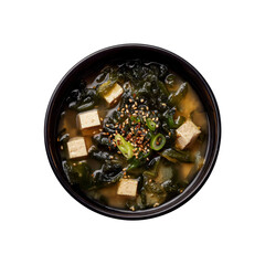 Delicious Wakame Miso Soup with Tofu, Sesame Seeds, and Green Onions in a Black Bowl