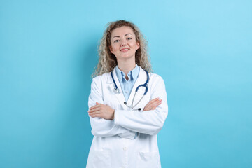 Portrait of pediatrician on light blue background