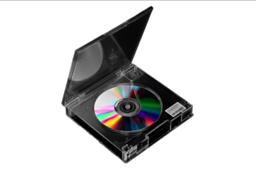 Black and white photograph of an open CD case with a colorful disc inside isolated on a transparent background top view