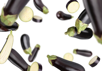 Fresh ripe eggplants flying on white background © New Africa