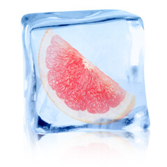 Piece of fresh grapefruit inside ice cube on white background