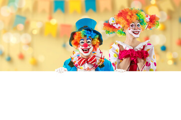 Funny clowns peeking out from behind sign blank template mock up for advertising, posters,...