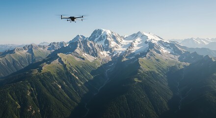 Drone flying over a vast mountain range with snow-capped peaks and green forested valleys under a clear blue sky.