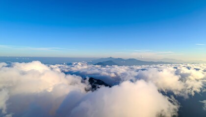 Naklejka premium Aerial view of clouds and mountains