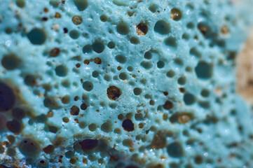 Porous structure of glass slag. Close-up of blue vitreous artificial stone.