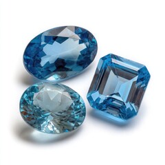 Three light blue gemstones